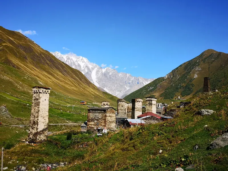 Svan towers of Ushguli with Mount Shkhara behind